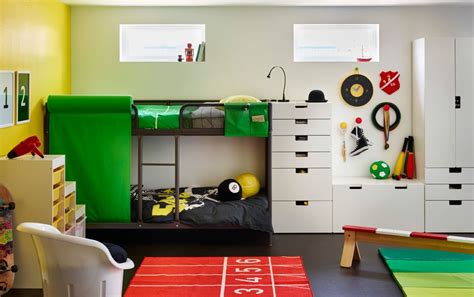 A children’s room with a grey bunk bed and white storage combined with colourful bedlinen and ...