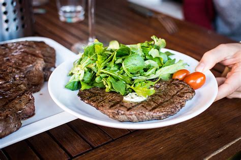 Royalty-Free photo: Barbequed beef steak with greens | PickPik