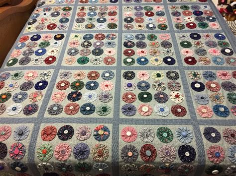 This is my version of a yo-yo quilt. Each yo-yo was hand appliquéd to ...