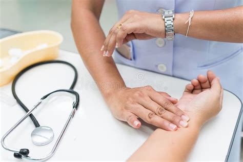 Nurse is Measurement Radial Pulse at the Wrist of the Patient. Stock Image - Image of finger ...