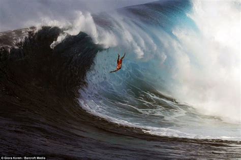 Totally bogus dude: Surfers wipe out as enormous 12m wave swallows them ...