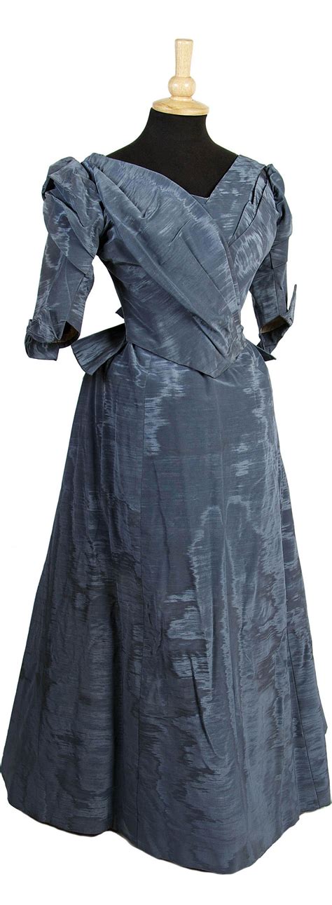 An 1880s blue moiré ribbed silk dress, comprising a bodice and skirt ...