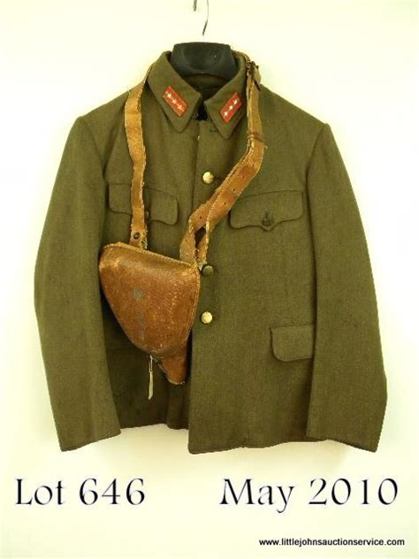 Japanese WWII Sargeant’s tunic with collar rank insignia, pants, holster with strap, ID on front t