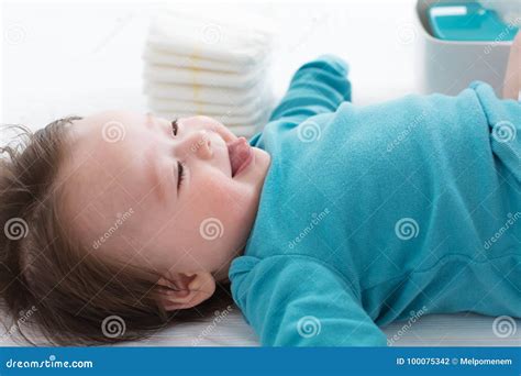 Baby Boy Preparing for a Diaper Change Stock Photo - Image of adorable, diaper: 100075342