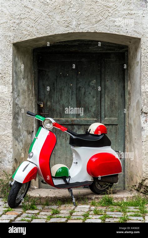 Parked Vespa scooter painted in Italian flag colors, Rome, Lazio, Italy ...