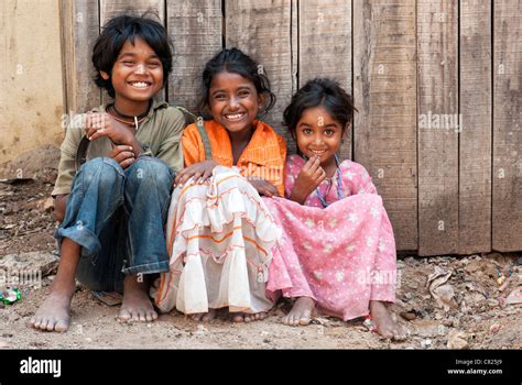 Happy young poor lower caste Indian street children smiling and laughing. Andhra Pradesh, India ...