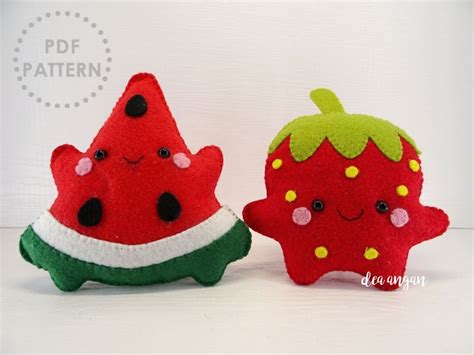 two stuffed fruits are sitting next to each other