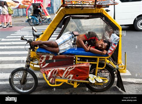 Driver sleeping on his Tricycle in Manila, Philippines Stock Photo - Alamy