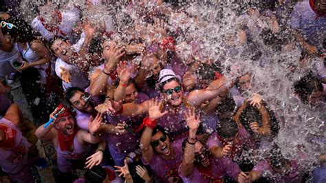 Revelers celebrate opening of running of the bulls festival in Pamplona ...