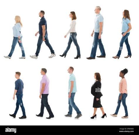 Group Of People Walking In Line Stock Photo - Alamy