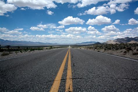 Black Top Road Under Clear Blue Cloudy Sky · Free Stock Photo