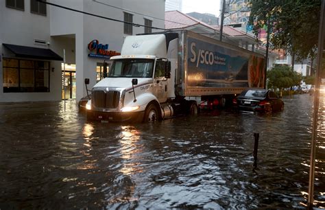 Shock images show Miami flooding and cars floating in up to 12 inches ...