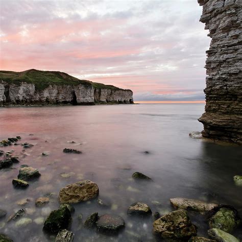 Sunset Over Rocky Coastline by Photo concepts