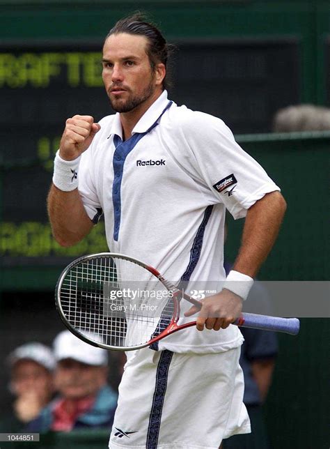 Patrick Rafter of Australia celebrates winning the first set from... | Andre agassi, Patrick ...