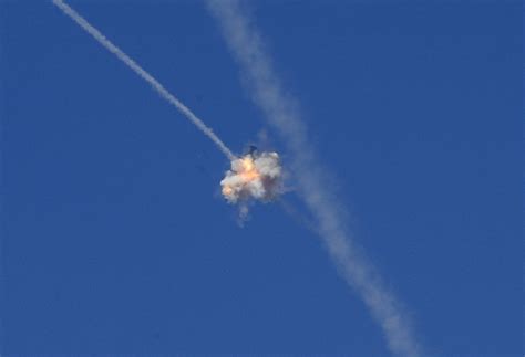 An interception of a rocket by the Iron Dome anti-missile system is seen above Sderot [1257 × ...