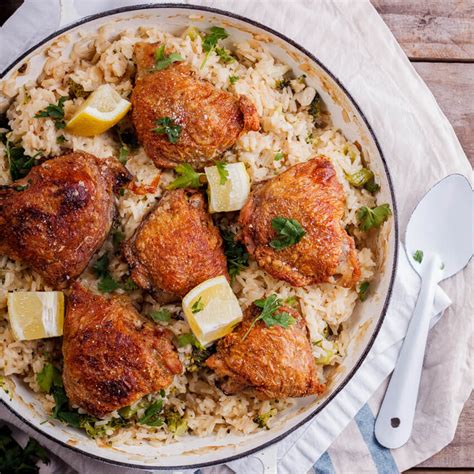 Crispy chicken thighs on cheesy broccoli rice - Simply Delicious