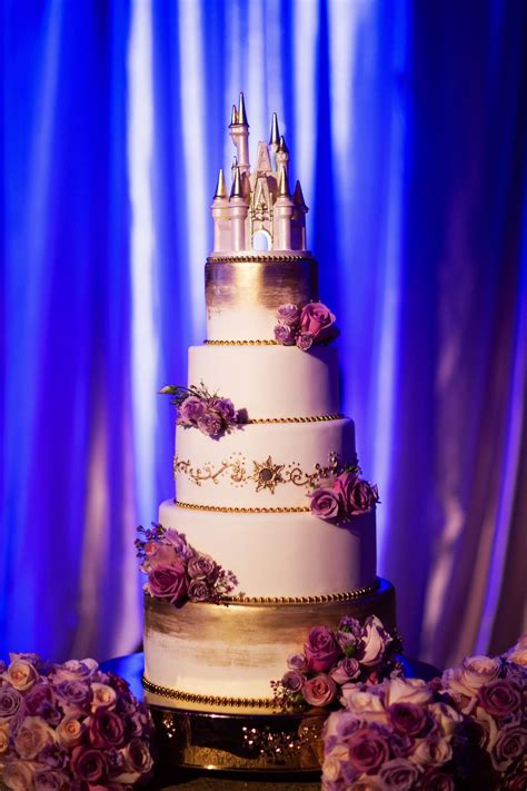Tangled-Inspired wedding cake with purple floral, gold detailing, and a ...
