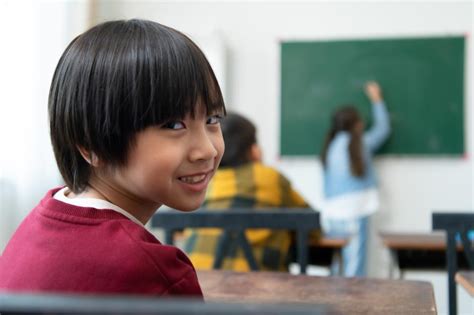 Free Stock Photo of Student in a classroom looking at the back of the room | Download Free ...