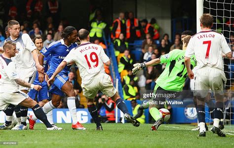 Didier Drogba of Chelsea scores his team's fourth goal past Jussi ...