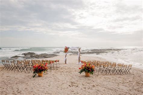 The wedding ceremony at Sean & Elia's tropical beach wedding at Cala Luna Boutique Hotel in ...