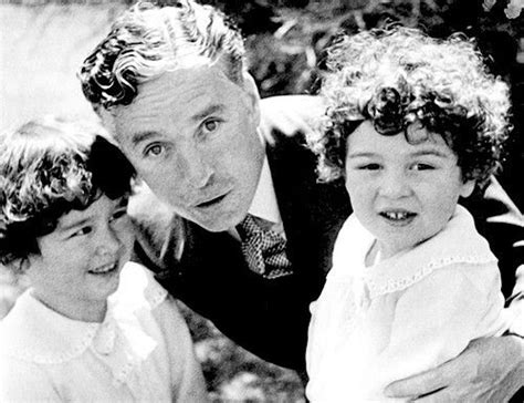 Charlie Chaplin with his sons, Charles Jr. and Sydney, 1929.