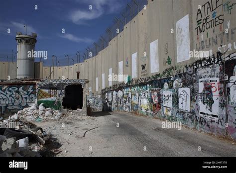 Political graffiti painted on the Palestinian side of the Wall of ...