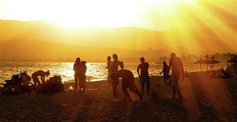 Sunset on a beach in Palma de Mallorca Photograph by Juergen Faelchle - Fine Art America