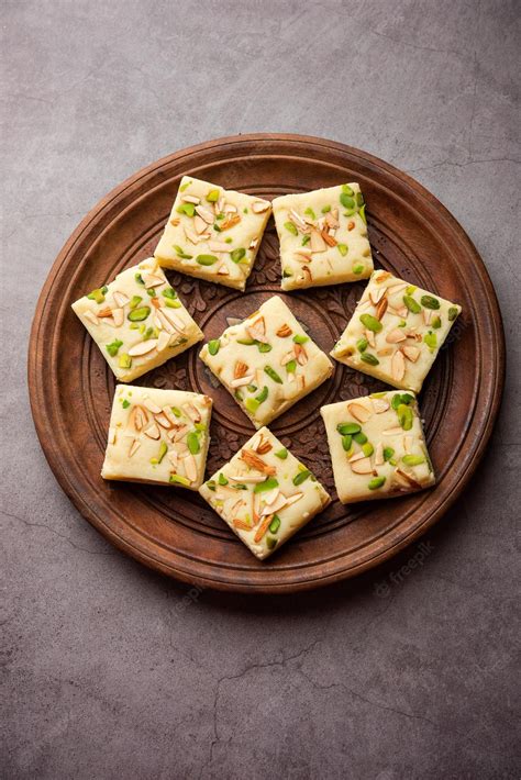 Premium Photo | Milk powder barfi also known as Mava burfi white Khoya burfi or Barfee Indian ...