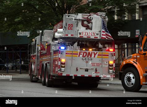 Tower ladder fire truck rear view with flag Manhattan New York USA ...