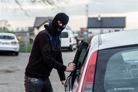 Car Thief Stealing Vehicle stock photo. Image of drive - 149663636