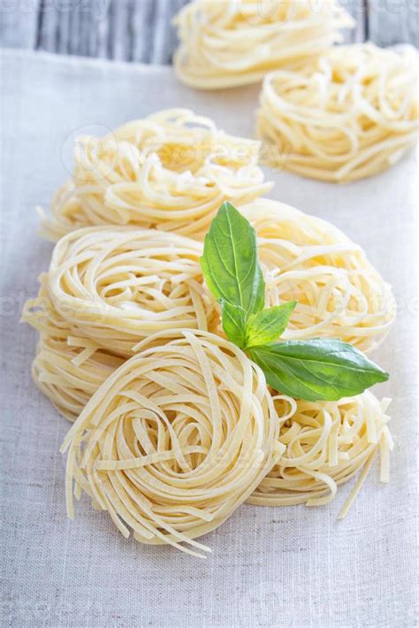 Dry pasta with fresh basil 15689766 Stock Photo at Vecteezy