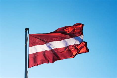 The flag of Latvia is red stock image. Image of latvian - 128981631