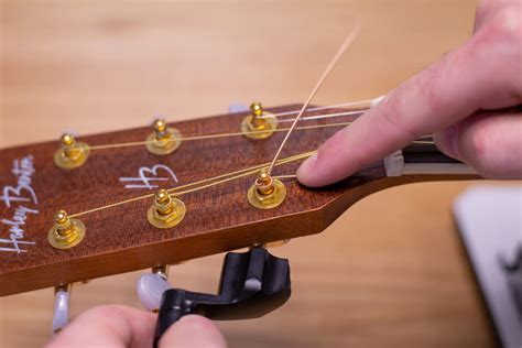 How to Change Guitar Strings (Guide) | Yousician