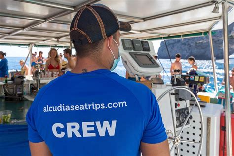 Mallorca: boat trip in times of Covid-19. Alcúdia Sea Trips crew with face mask during the ...