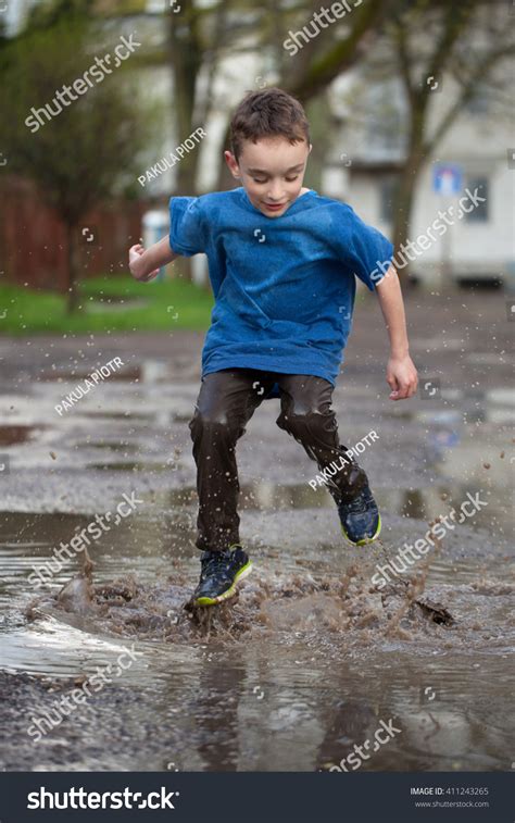 Little Boy Splashing Mud Puddle Jumping Stock Photo 411243265 ...