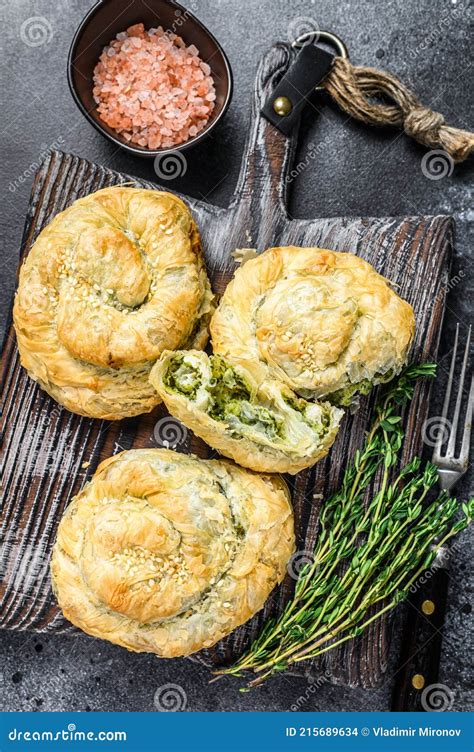 Baked Spanakopita Spiral Filo Pastry Puff Pie With Feta Cheese And Spinach. Black Background ...