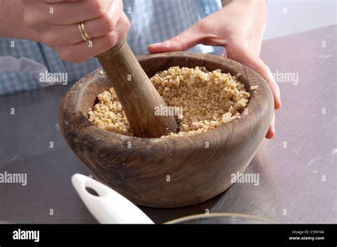 Baklava: crushing nuts Stock Photo - Alamy