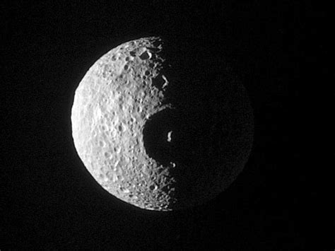 APOD: 2005 March 8 - Crater on Mimas