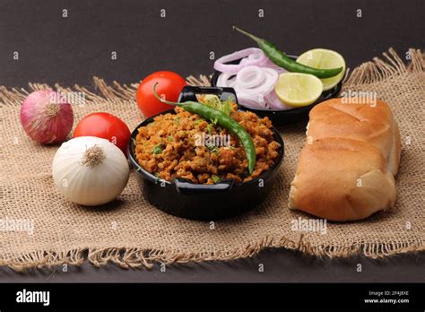 Masala Anda Bhurji or Spicy Indian scrambled eggs with bread or Bun Pav ...