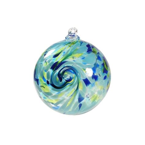 a glass ornament with blue and green swirls