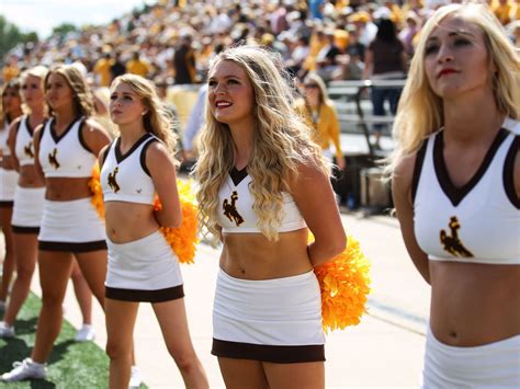 Scenes of college football: Spirited cheerleaders, passionate fans ...