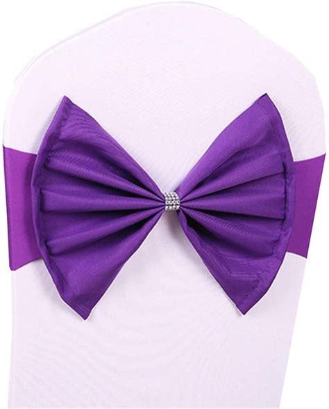 a purple bow tie sitting on top of a white chair