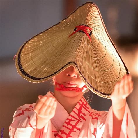 This cone-shaped straw hat is a type of traditional Japanese hat called 'kasa'. 🎌 It acts as an ...