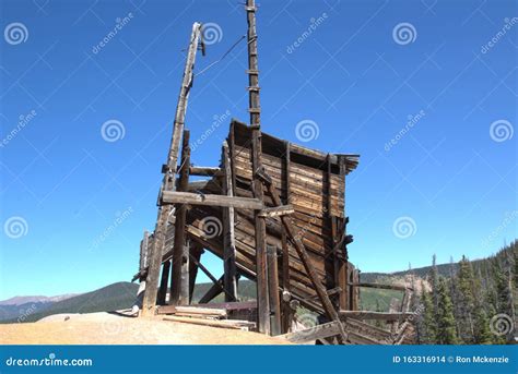 An Old Abandoned Mine Sits on Top of the Mountain Stock Photo - Image of color, abandoned: 163316914