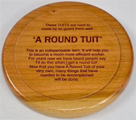 A Round Tuit turned laser engraved Large Cherry wooden