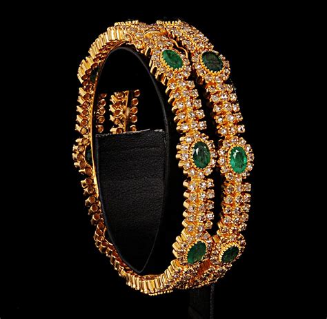 22 carat Gold Bangle studded with diamonds and emeralds. | Gold jewelry outfits, Bangles jewelry ...