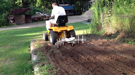 cub cadet 1450 in garden with cultivator - YouTube