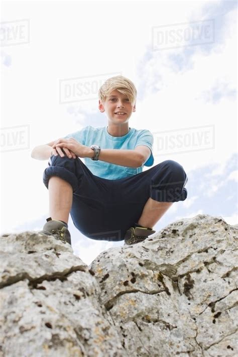 Boy on a rock - Stock Photo - Dissolve