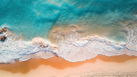 Premium AI Image | An aerial view of a beach with a blue ocean and pink ...