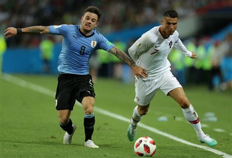 Cristiano Ronaldo and Nahitan Nandez Photos Photos - Uruguay v Portugal ...